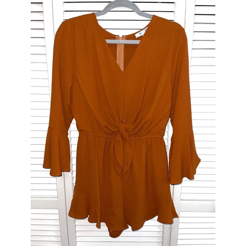 A burnt orange romper, never worn!